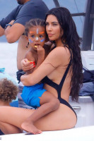 Kim Kardashian in a swimsuit hit the lenses of the paparazzi