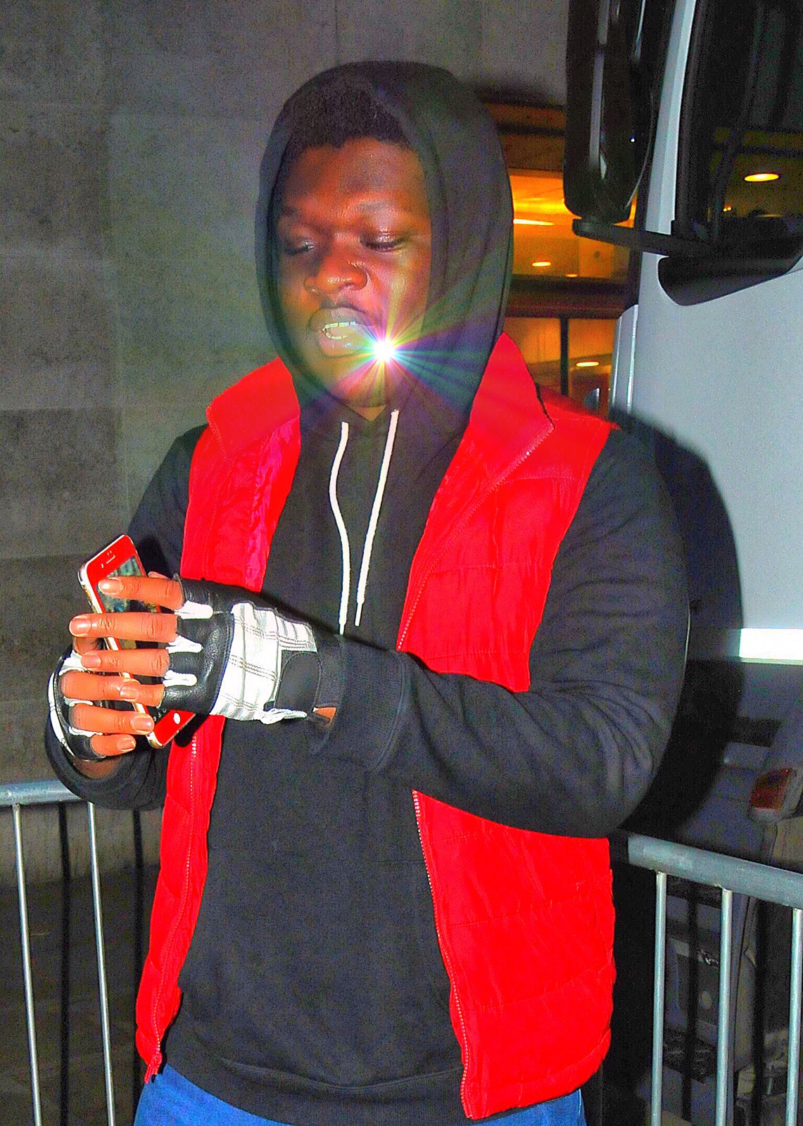 Dwen Gyimah Holding Red IPhone +